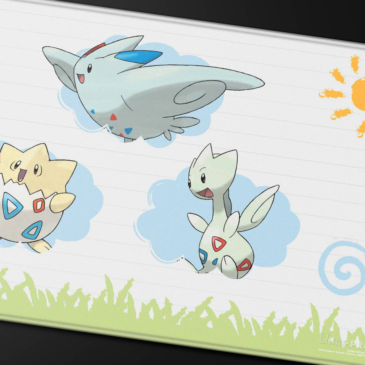 Detail van de gestikte rand en Pokémon-illustratie van de Ultra PRO Togepi Evolutions playmat